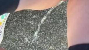 slut pisses outside during the day